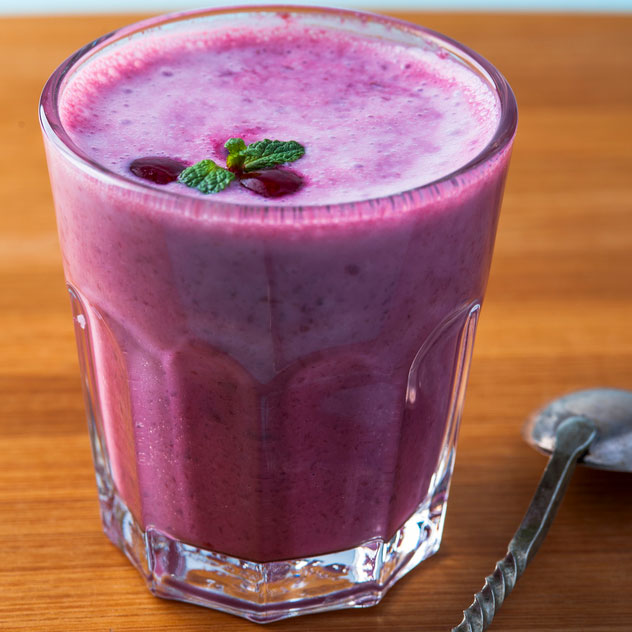 photodune-15011513-glass-of-homemade-smoothie-with-cherry-mint-leaves-and-spoon-on-wooden-table-s